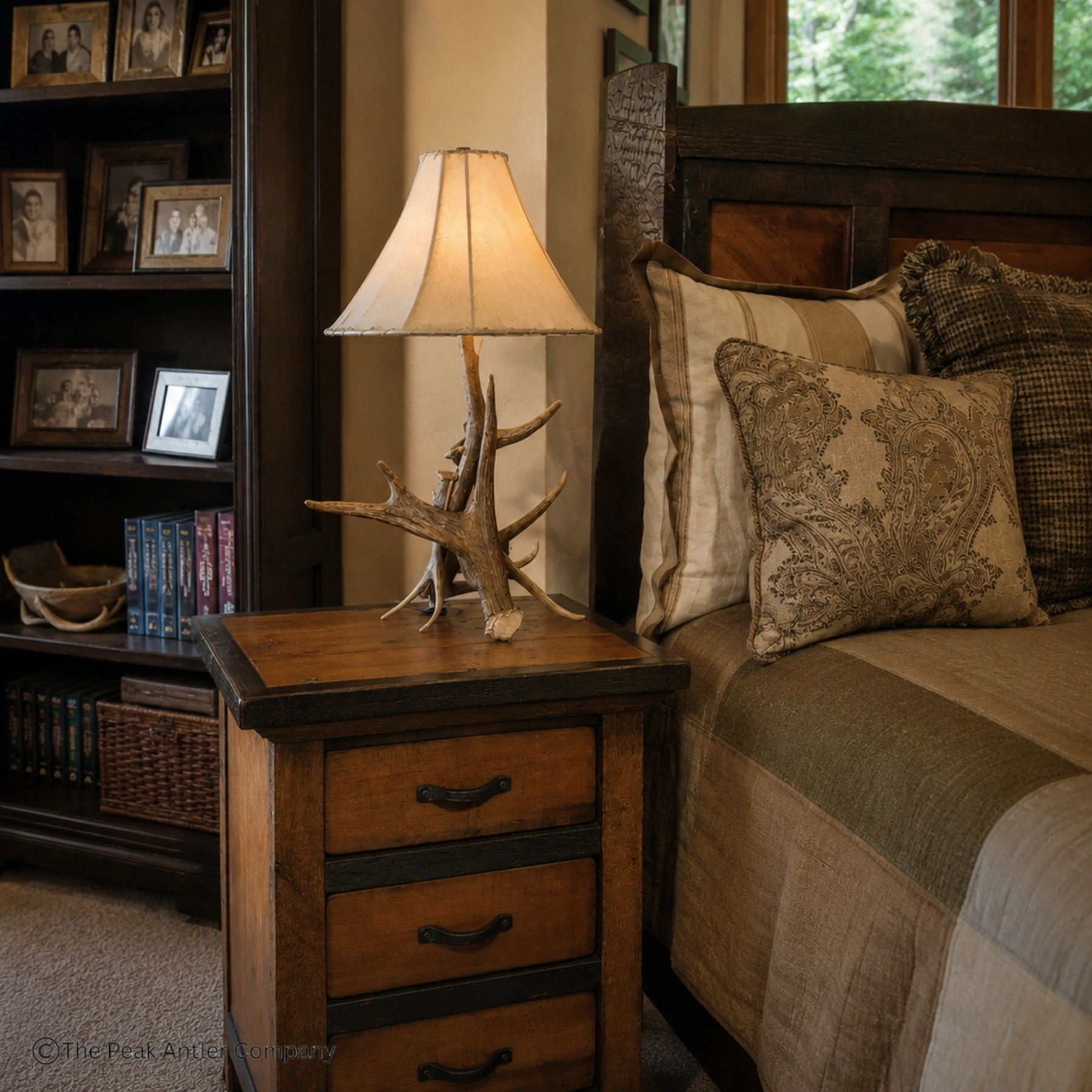 elk and moose antler table lamp in a master bedroom end table