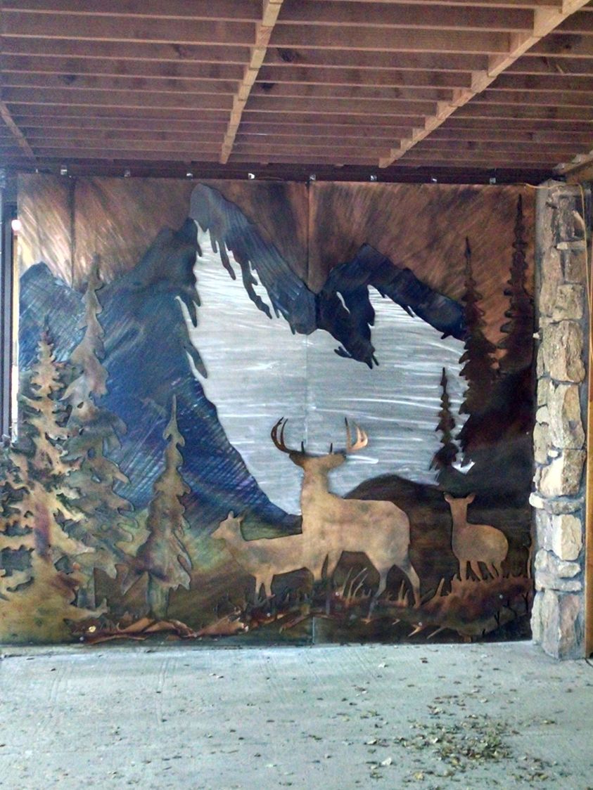 metal deer in the mountains 