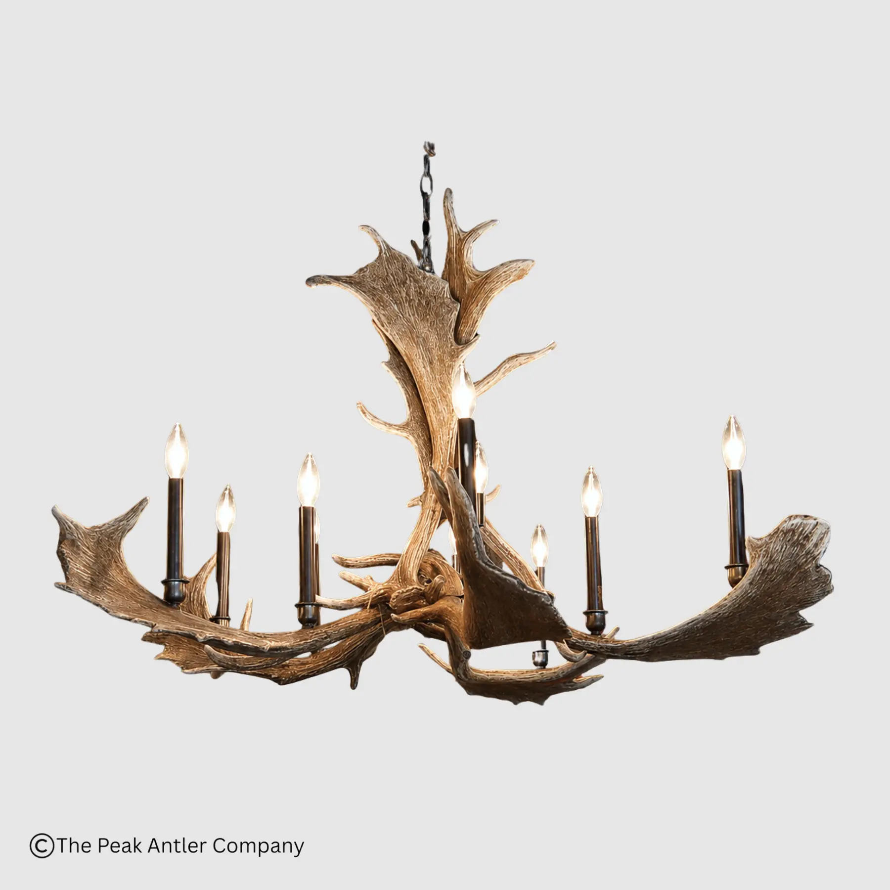 round fallow deer antler chandelier with tall copper candles