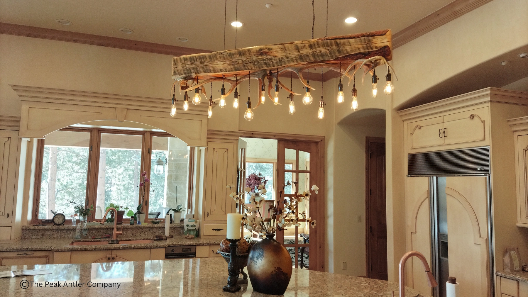 timberline elk and whitetail antler chandelier in a home kitchen over the bar