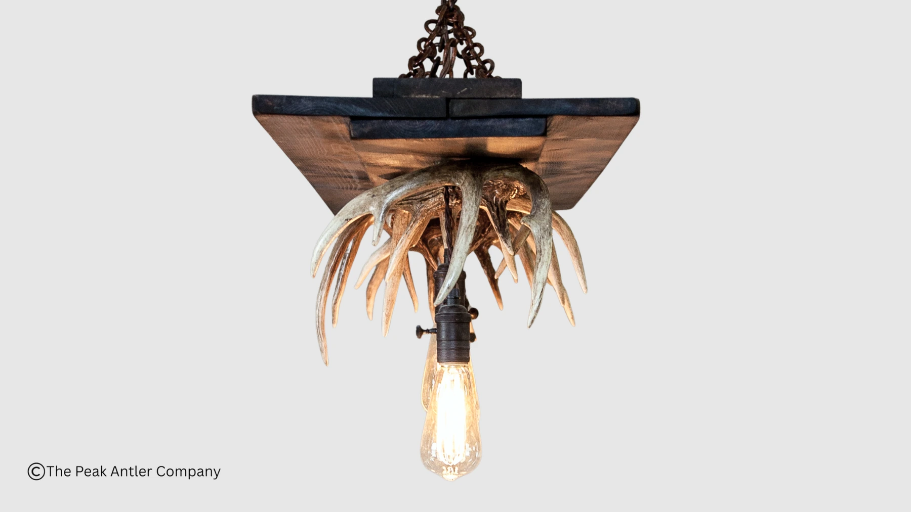 side view of the linear whitetail antler and timber chandelier