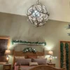 elk antler globe in a home bedroom over the master bed