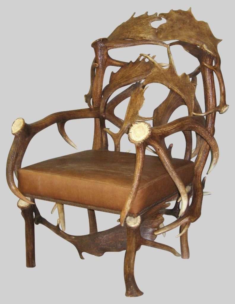 elk and fallow deer chair with brown leather cushion