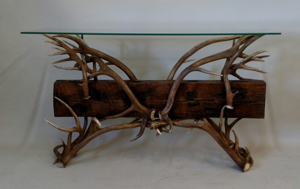 timberline elk and mule deer sofa table with a glass top