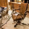 antler desk and rolling chair in home office
