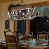 small elk snowmass chandelier over a dinning table
