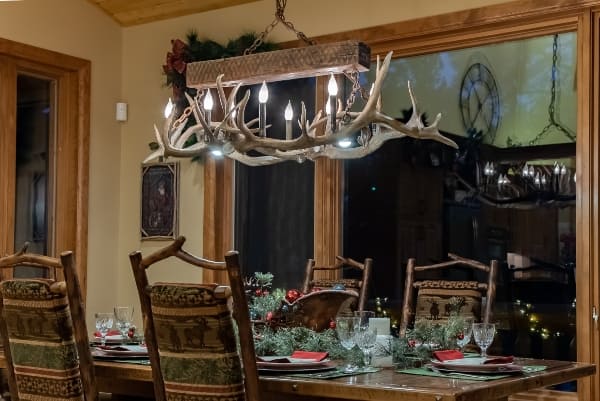 small elk snowmass chandelier over a dinning table