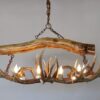small elk snowmass chandelier with a log over the top