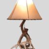 small whitetail table lamp with a natural rawhide lampshade