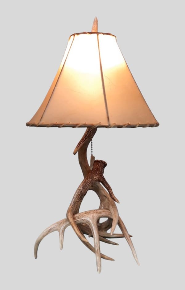 small whitetail table lamp with a natural rawhide lampshade
