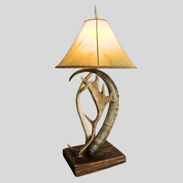 exotic table lamp with an ibex horn, axis deer and fallow deer antlers