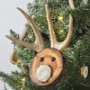wood round ornament made to look like a reindeer