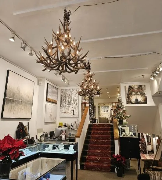 Two large Bristlecone antler chandeliers hanging in Bella Fine Goods store in Telluride, CO