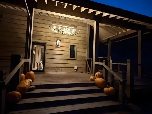 A small Snowmass Chandelier on the porch of a luxury Colorado home