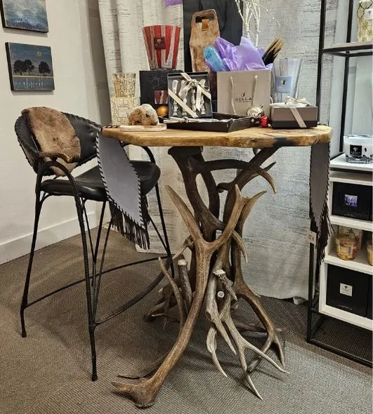 An Elk & Mule Deer Antler Table in Bella Fine Goods store in Telluride, CO