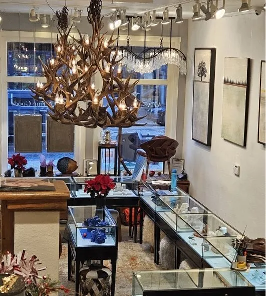 Two large Bristlecone antler chandeliers hanging in Bella Fine Goods store in Telluride, CO