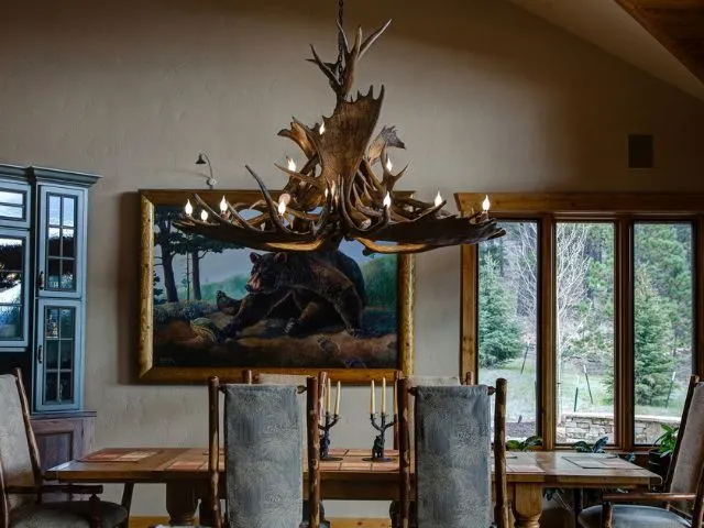 Mt. Massive Moose antler chandelier hanging over a dining room table in Colorado