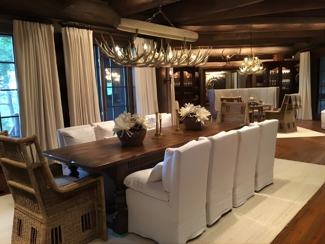 A Snowmass Chandelier hanging over a dining room table in the rustic Seven Lakes Ranch, CO.