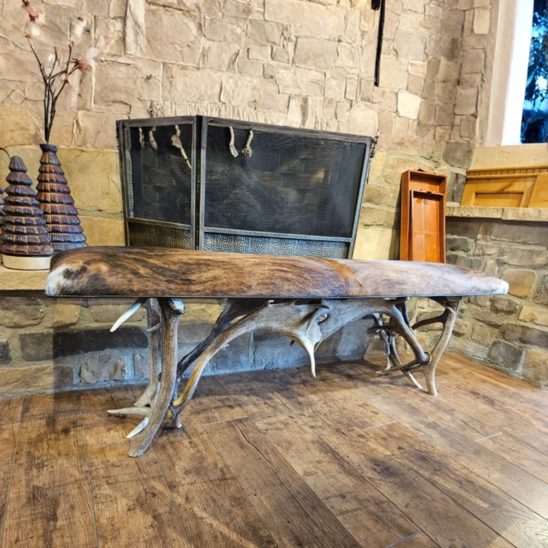 Custom elk antler bench with cowhide upholstery